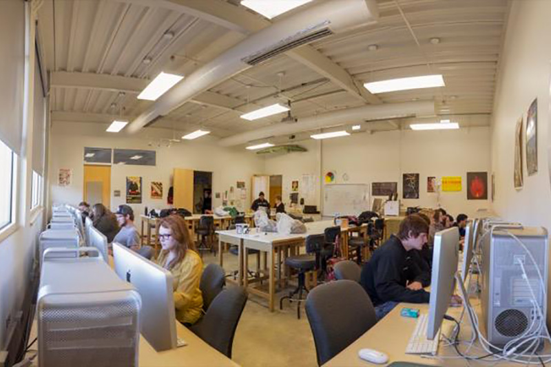 Students in a brightly lit graphics studio