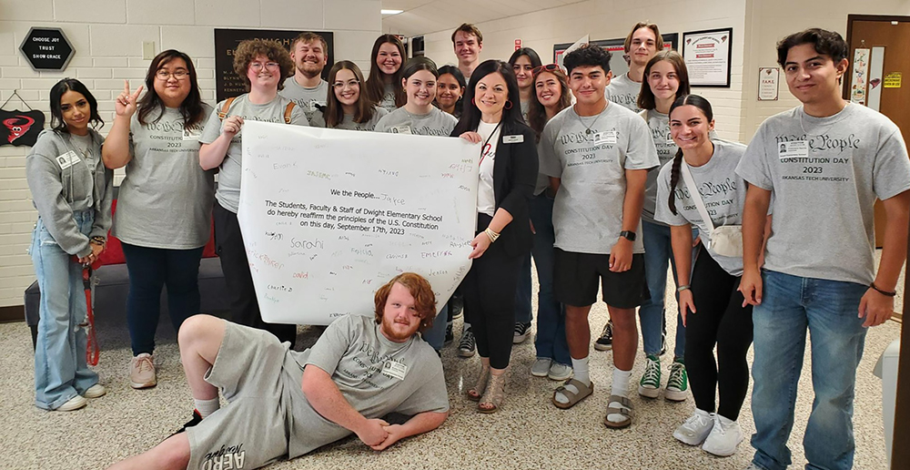 ATU students with Constitution Day banner sporting signatures from Dwight Elementary School students