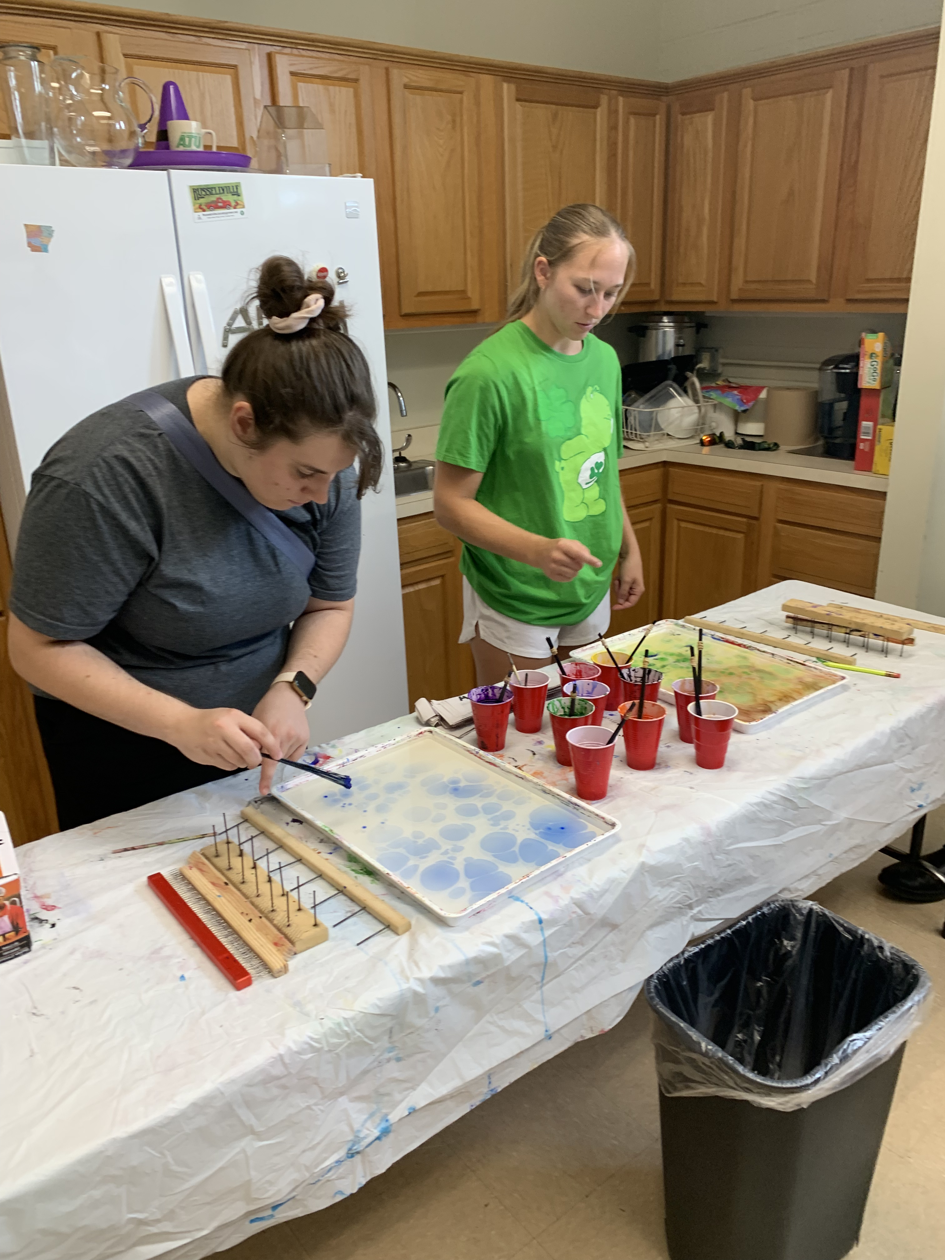 Two students try their hand at papermarbling