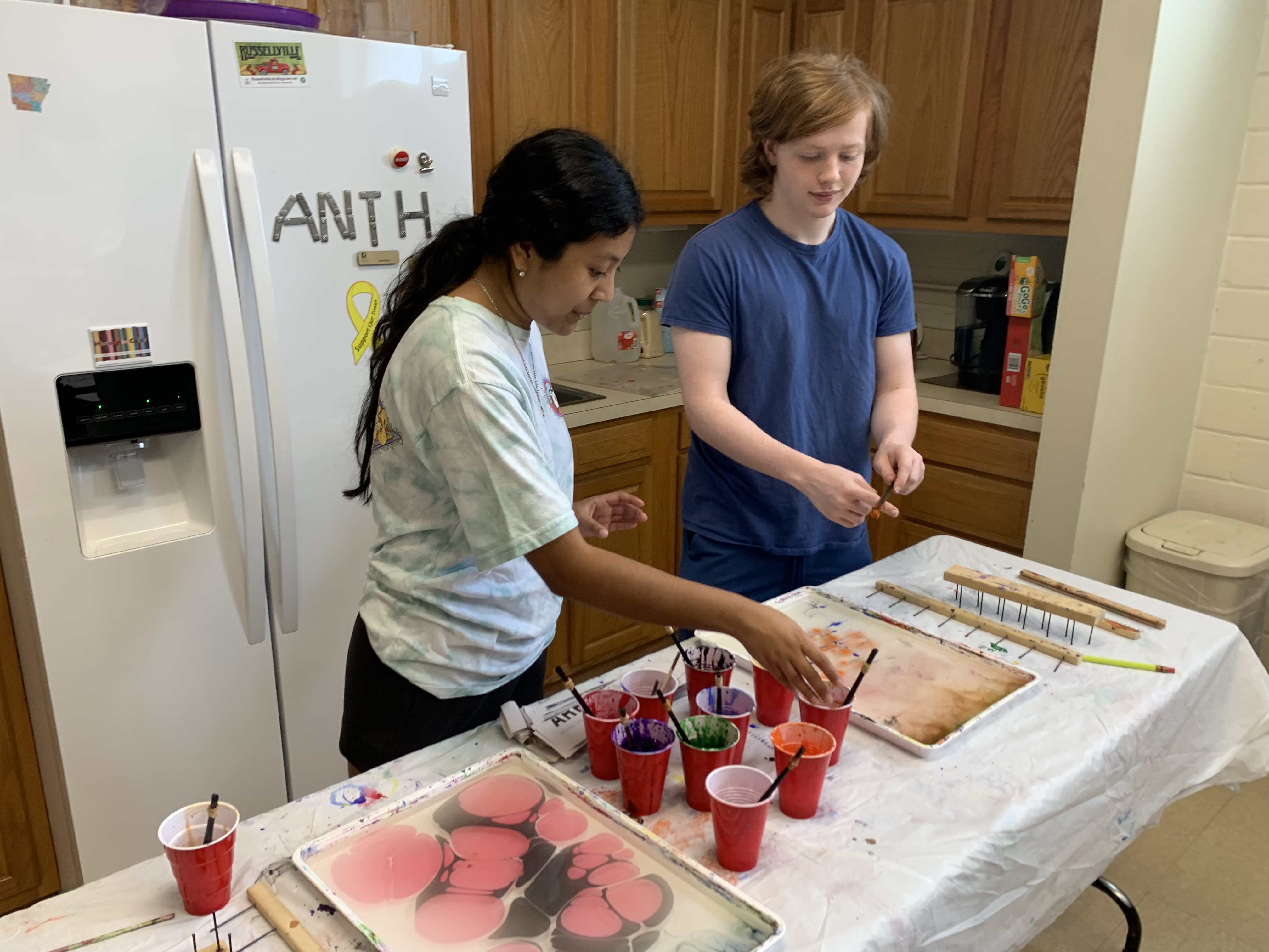 Two more students try paper marbling themselves